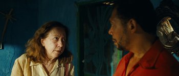 Movie still from “Central Station” (1998), directed by Walter Salles – A man and a woman talking in front of a window; Close Up shot, Over the shoulder angle