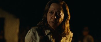 Movie still from “Central Station” (1998), directed by Walter Salles – An older woman with long brown hair wearing a white shirt; Close Up shot, Low angle