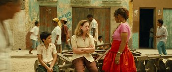 Movie still from “Central Station” (1998), directed by Walter Salles – Two women and a boy are talking to each other; Medium shot, Over the shoulder angle