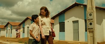 Movie still from “Central Station” (1998), directed by Walter Salles – A woman and a young boy standing next to each other; Medium shot, Low angle