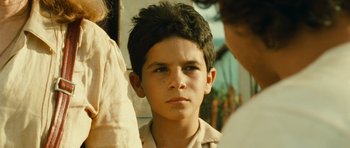 Movie still from “Central Station” (1998), directed by Walter Salles – A young boy is looking into the camera; Close Up shot, Over the shoulder angle
