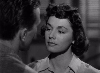 Movie still from “Champion” (1949), directed by Mark Robson – An old black and white photo of a man and a woman looking at each other; Close Up shot, Over the shoulder angle