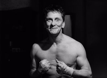 Movie still from “Champion” (1949), directed by Mark Robson – A black and white photo of a man in a boxing stance; Close Up shot, Low angle