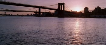 Movie still from “Changing Lanes” (2002), directed by Roger Michell – A view of the brooklyn bridge from the water at sunset; Extreme Wide shot, Low angle