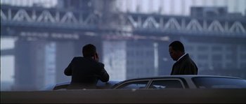 Movie still from “Changing Lanes” (2002), directed by Roger Michell – Two men are talking on their cell phones in a car; Wide shot, Over the shoulder angle