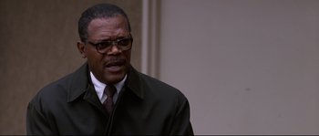 Movie still from “Changing Lanes” (2002), directed by Roger Michell – An older man wearing a suit and tie; Close Up shot, Low angle