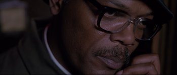 Movie still from “Changing Lanes” (2002), directed by Roger Michell – A man's face wearing glasses; Extreme Close Up shot, High angle