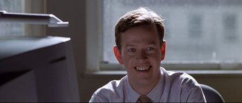 Movie still from “Changing Lanes” (2002), directed by Roger Michell – A person wearing a shirt and tie; Close Up shot, Low angle