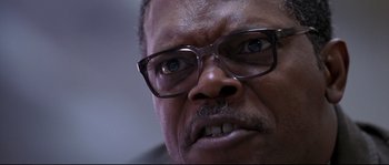 Movie still from “Changing Lanes” (2002), directed by Roger Michell – An older man wearing glasses looking at the camera; Extreme Close Up shot, Low angle