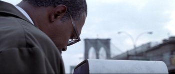 Movie still from “Changing Lanes” (2002), directed by Roger Michell – A person wearing glasses looking at a phone; Close Up shot, Low angle