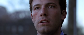 Movie still from “Changing Lanes” (2002), directed by Roger Michell – A man's face with blood on his face; Close Up shot, Low angle