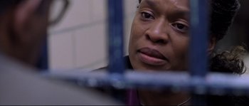 Movie still from “Changing Lanes” (2002), directed by Roger Michell – A person looking at the camera; Close Up shot, Over the shoulder angle