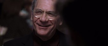 Movie still from “Changing Lanes” (2002), directed by Roger Michell – An older man wearing glasses and a suit; Close Up shot, Over the shoulder angle