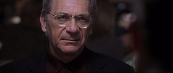 Movie still from “Changing Lanes” (2002), directed by Roger Michell – An older man wearing glasses and wearing a suit; Close Up shot, Low angle