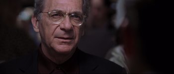 Movie still from “Changing Lanes” (2002), directed by Roger Michell – An older man wearing glasses and a suit; Close Up shot, Low angle