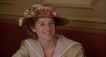 Movie still from “Chaplin” (1992), directed by Richard Attenborough – A person wearing a hat; Close Up shot, Over the shoulder angle