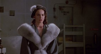 Movie still from “Chaplin” (1992), directed by Richard Attenborough – A woman wearing a hat and a fur coat; Medium shot, Low angle