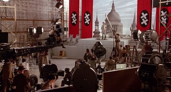 Movie still from “Chaplin” (1992), directed by Richard Attenborough – A film crew is working on a scene; Wide shot, High angle