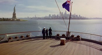 Movie still from “Chaplin” (1992), directed by Richard Attenborough – Two men standing on the deck of a boat; Extreme Wide shot, High angle