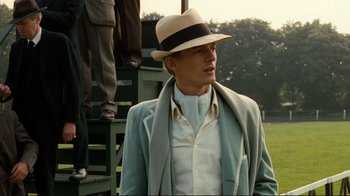 Movie still from “Chariots of Fire” (1981), directed by Hugh Hudson – A man wearing a hat and a jacket; Medium shot, Low angle