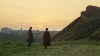 Movie still from “Chariots of Fire” (1981), directed by Hugh Hudson – Two men standing on a hill looking at a city; Extreme Wide shot, High angle