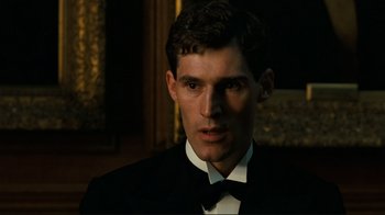 Movie still from “Chariots of Fire” (1981), directed by Hugh Hudson – A man in a suit and bow tie; Close Up shot, Low angle