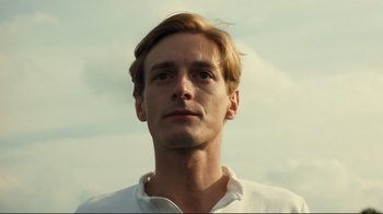 Movie still from “Chariots of Fire” (1981), directed by Hugh Hudson – A person wearing a white shirt; Close Up shot, Low angle