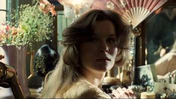 Movie still from “Chariots of Fire” (1981), directed by Hugh Hudson – A person with long brown hair; Close Up shot, Low angle