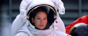 Movie still from “Charlie's Angels” (2000), directed by McG – A woman in a spacesuit looking into a mirror; Close Up shot, Low angle