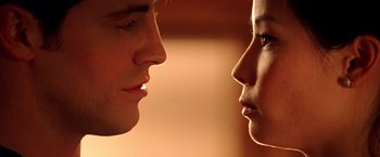 Movie still from “Charlie's Angels” (2000), directed by McG – A man and a woman face to face in front of each other; Extreme Close Up shot, Low angle