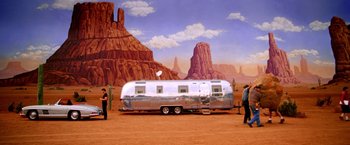 Movie still from “Charlie's Angels” (2000), directed by McG – An airstream trailer parked in the middle of the desert; Wide shot, Low angle