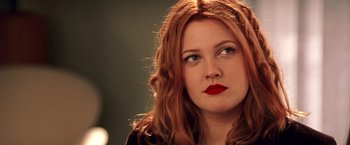 Movie still from “Charlie's Angels” (2000), directed by McG – A person with long red hair; Close Up shot, Low angle