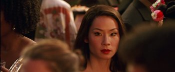Movie still from “Charlie's Angels” (2000), directed by McG – A person wearing a red lipstick; Close Up shot, Over the shoulder angle