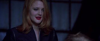 Movie still from “Charlie's Angels” (2000), directed by McG – A woman with red hair and red lipstick; Close Up shot, Over the shoulder angle