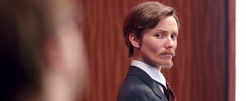 Movie still from “Charlie's Angels” (2000), directed by McG – A person wearing a suit and tie; Close Up shot, Over the shoulder angle