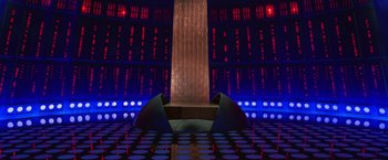 Movie still from “Charlie's Angels” (2000), directed by McG – A room filled with lots of lights and a tall brick wall; Extreme Wide shot, Low angle