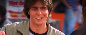 Movie still from “Charlie's Angels” (2000), directed by McG – A person smiling for the camera; Close Up shot, Over the shoulder angle