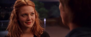 Movie still from “Charlie's Angels” (2000), directed by McG – A woman with red hair is talking to a man; Close Up shot, Over the shoulder angle