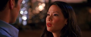 Movie still from “Charlie's Angels” (2000), directed by McG – A person looking up at the sky; Close Up shot, Over the shoulder angle