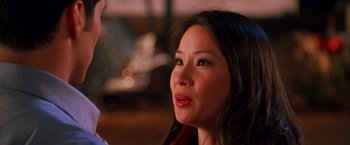 Movie still from “Charlie's Angels” (2000), directed by McG – A person with long black hair; Close Up shot, Over the shoulder angle