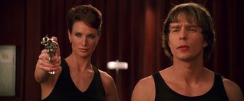 Movie still from “Charlie's Angels” (2000), directed by McG – Two women are posing for a picture in front of a mirror; Close Up shot, Over the shoulder angle