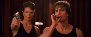 Movie still from “Charlie's Angels” (2000), directed by McG – A man and a woman standing next to each other; Medium shot, Over the shoulder angle