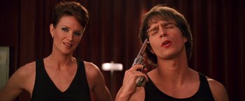 Movie still from “Charlie's Angels” (2000), directed by McG – A woman and a man holding a gun in their hands; Close Up shot, Low angle