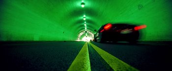 Movie still from “Charlie's Angels” (2000), directed by McG – A car driving down a street in a tunnel; Wide shot, High angle