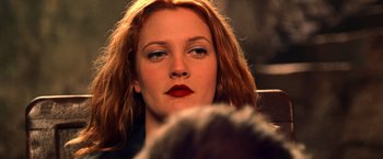 Movie still from “Charlie's Angels” (2000), directed by McG – A person with red hair; Close Up shot, Over the shoulder angle