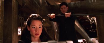 Movie still from “Charlie's Angels” (2000), directed by McG – A man and a woman in a dark room; Close Up shot, Low angle