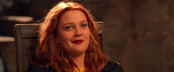 Movie still from “Charlie's Angels” (2000), directed by McG – A person with long red hair; Close Up shot, Over the shoulder angle