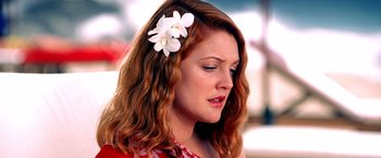Movie still from “Charlie's Angels” (2000), directed by McG – A person with a flower in her hair; Close Up shot, Over the shoulder angle