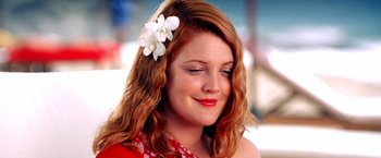 Movie still from “Charlie's Angels” (2000), directed by McG – A beautiful young lady wearing a flower in her hair; Close Up shot, Low angle