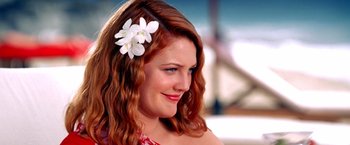 Movie still from “Charlie's Angels” (2000), directed by McG – A person with a flower in her hair; Close Up shot, Over the shoulder angle